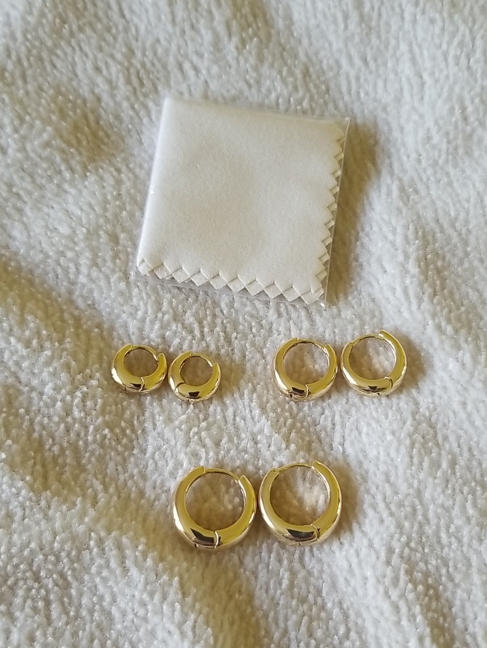 Three Pairs Of Gold Toned Earrings